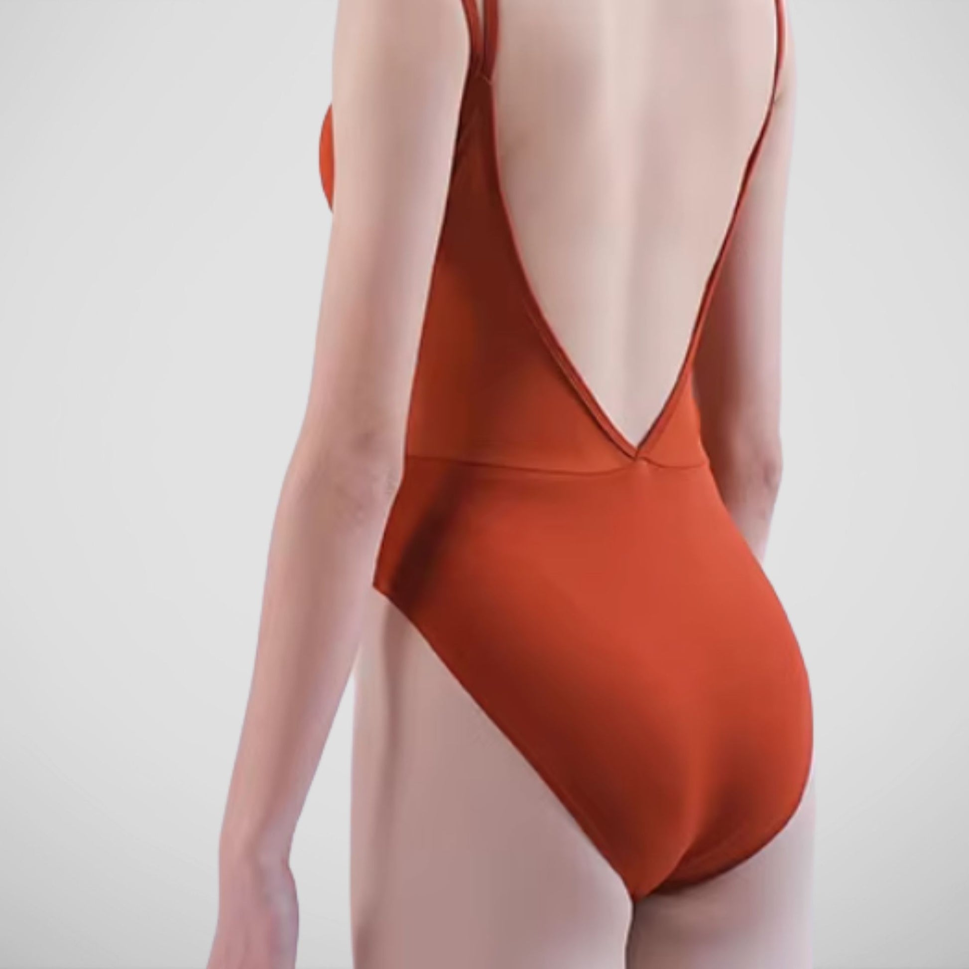 L’étoile Cotton Camisole Leotard with princess seams, double shoulder straps, adjustable front drawstring, and deep V-back — soft cotton blend gentle on sensitive skin.